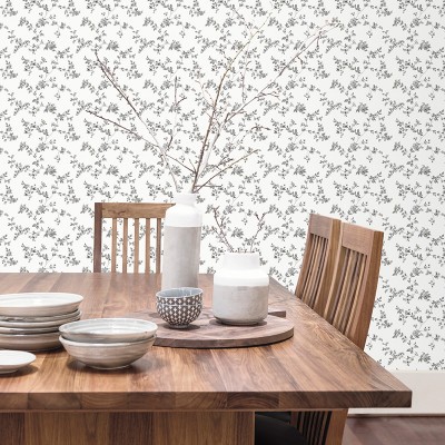 papel pintado con flores pequeñas de color negro con un fondo blanco. 2