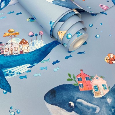 Paper pintat infantil amb balenes fons blau